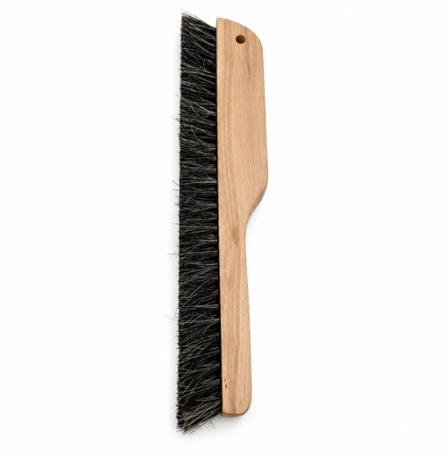 Straight-on profile of wooden plaster texturing brush